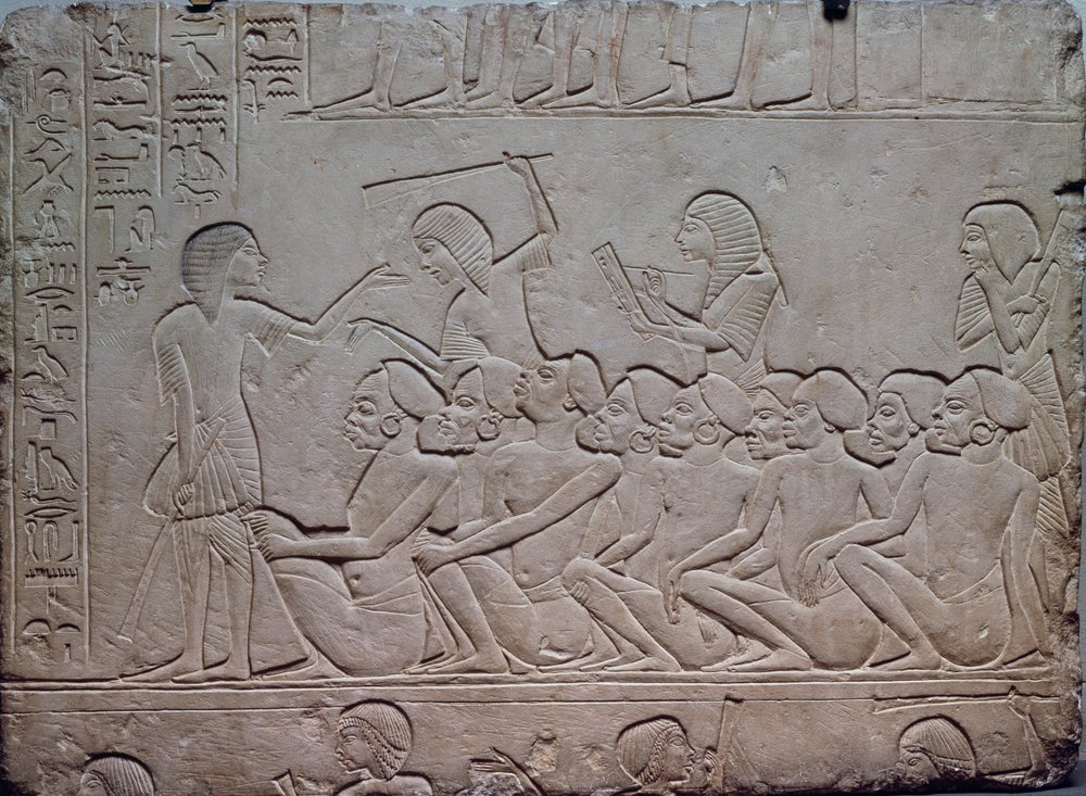 Black prisoners surrounded by armed guards, relief from the Memphite ...
