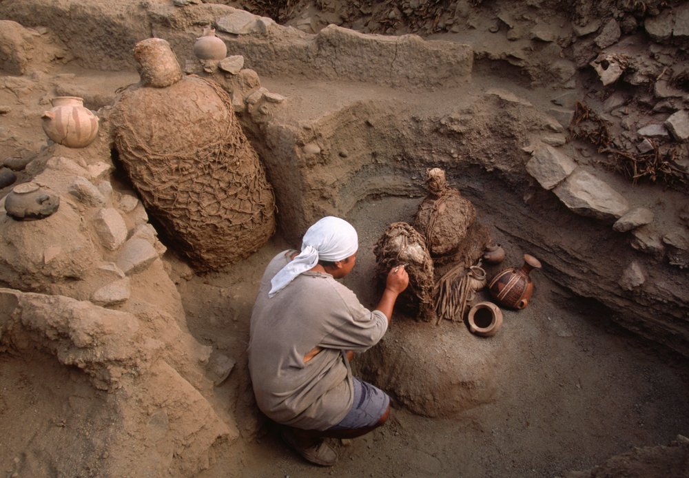 Richard Gomez cleaning newly discovered artifacts at the school dig site