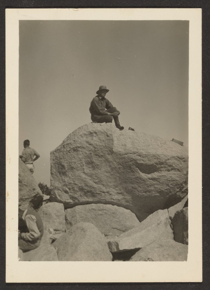 [Man Seated on Rocks] by Louis Fleckenstein