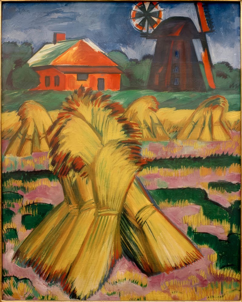 Sheaves of Corn in Front of Red House and Windmill by Max Pechstein