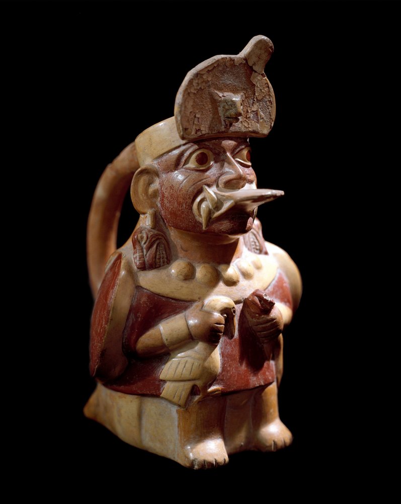Pre-Columbian art, Moche culture (Moche, Mochica): anthropomorphic vase representing a priest sacrificing two animals. 200 BC-700 AD. Lima, National Museum of Anthropology and Archaeology by Moche Moche