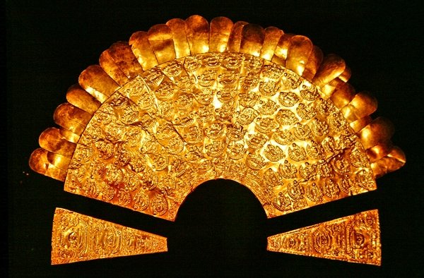 Repousse breastplate adorned with birds and seven rows of human figures ...