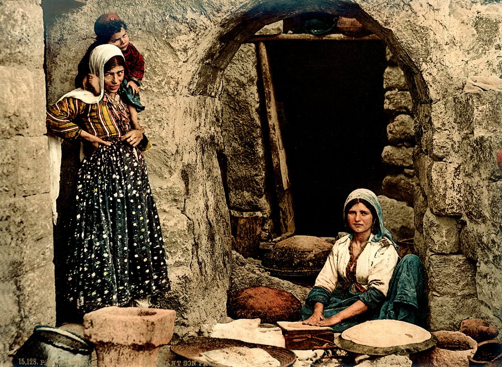 Lebanese women making bread in front of their house