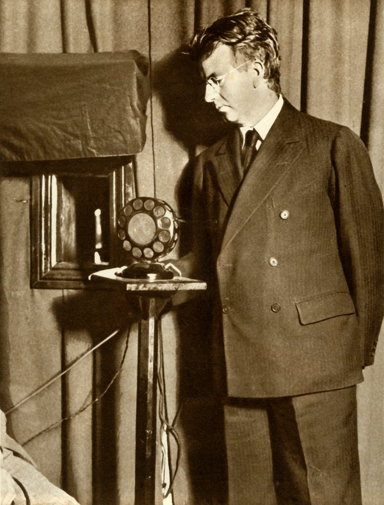 John Logie Baird watching the first play to be televised, 14 July 1930