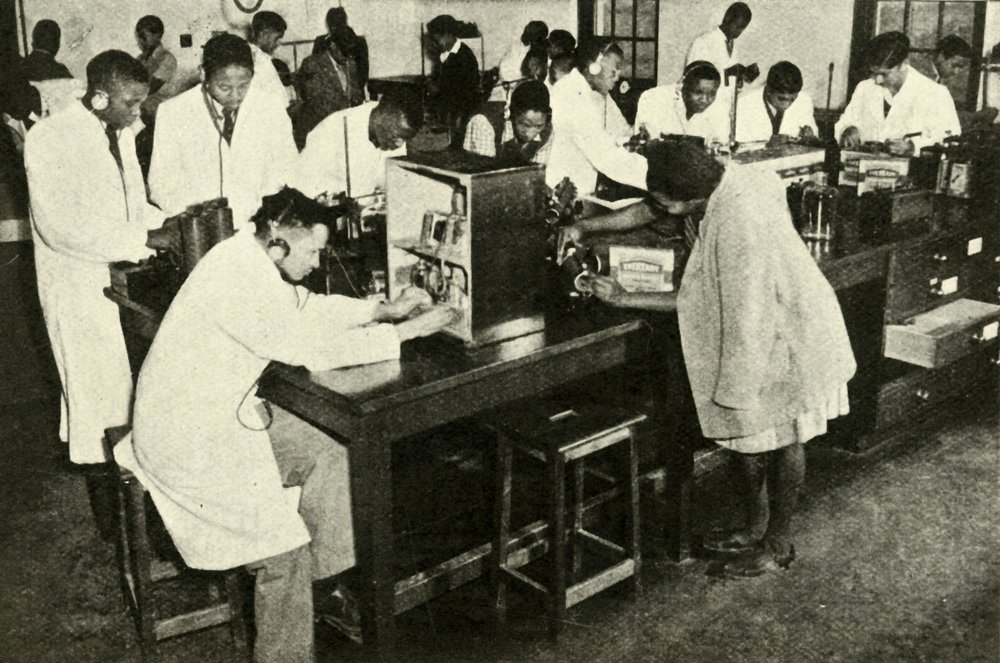 Scenes in a Native College - Students in the physics laboratory