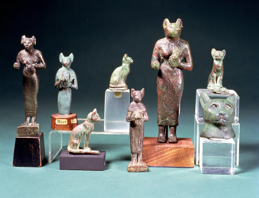 Several statuettes of the cat-goddess Bast and cat figurines ...