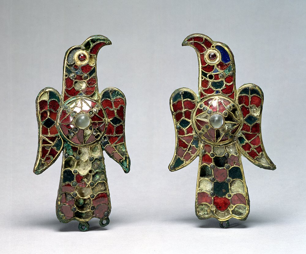 Two eagle-shaped fibulae, discovered in a cemetery in the Province of Badajoz, Spain, 6th century, gilt bronze, garnets and rock crystal by Visigothic
