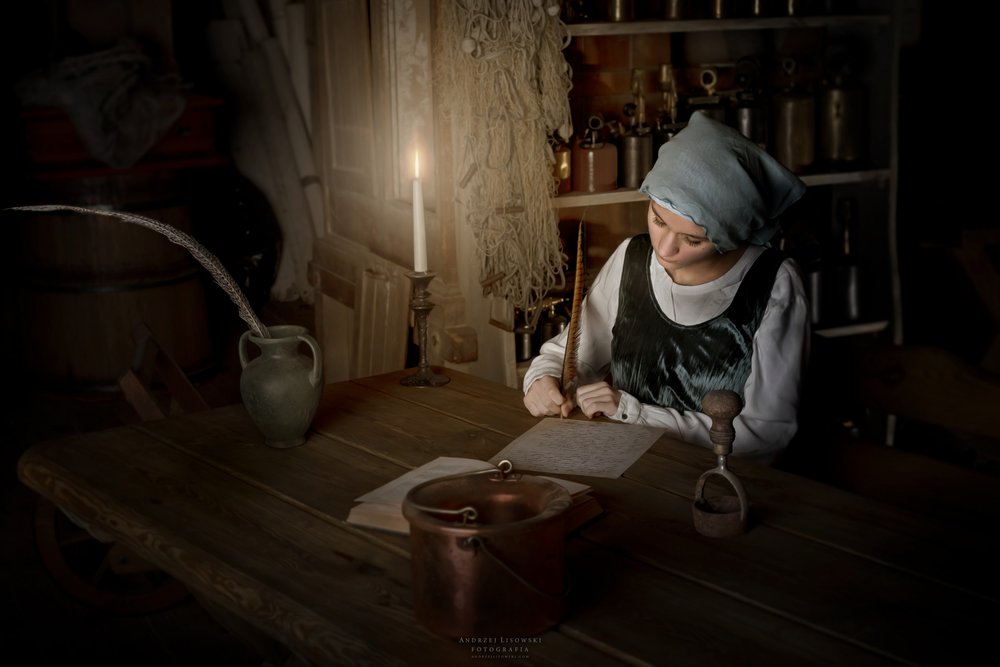Woman Writing by Candlelight by Andrzej Lisowski