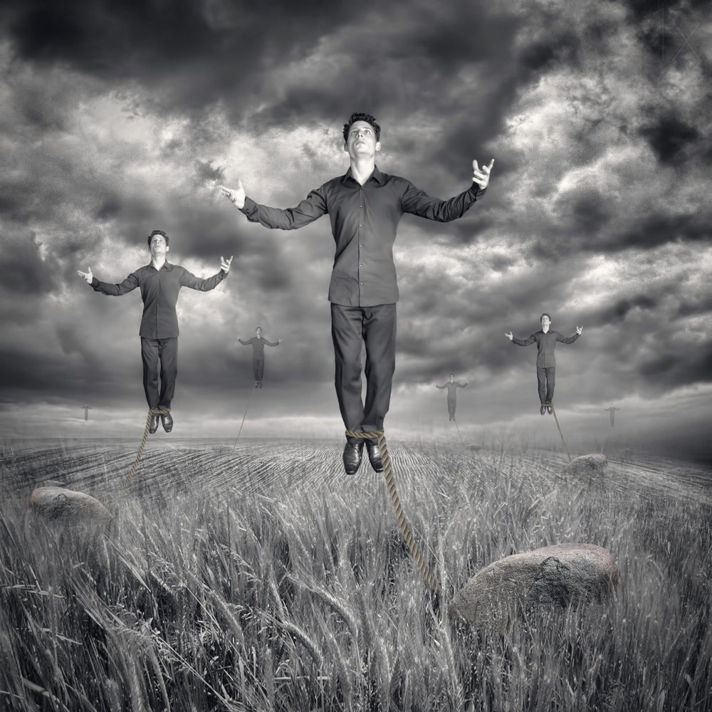 Levitating Men Stormy Sky by Baden Bowen