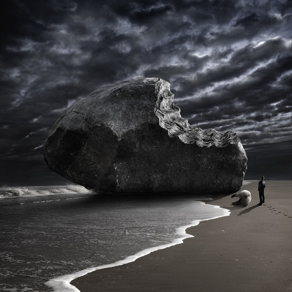 Bitten Rock on Stormy Beach by Christophe Kiciak
