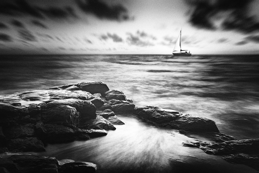 Sailboat Over Rocky Coast by Gustav Davidsson