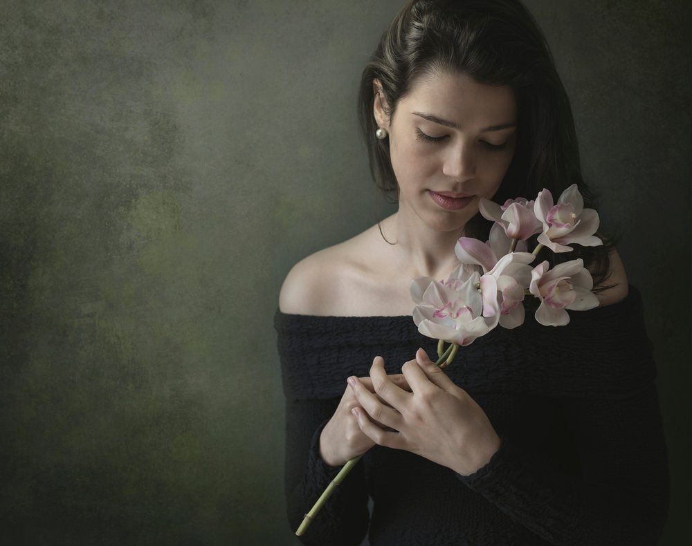 Serene Woman with Orchids by Margareth Perfoncio