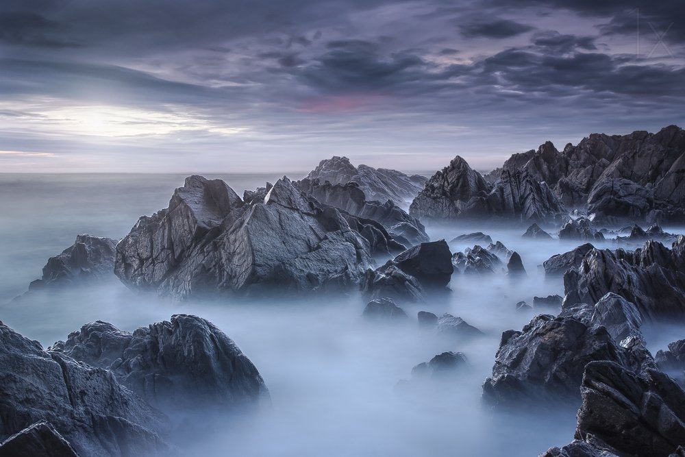 Misty Ocean Rocks by Nuno Araujo