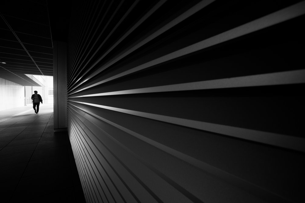 Lone Figure In Tunnel by Satoshi Hata