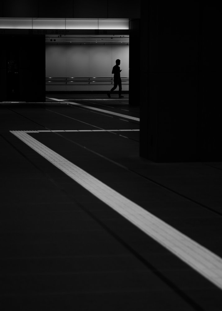 Lone Figure Underpass by Satoshi Hata