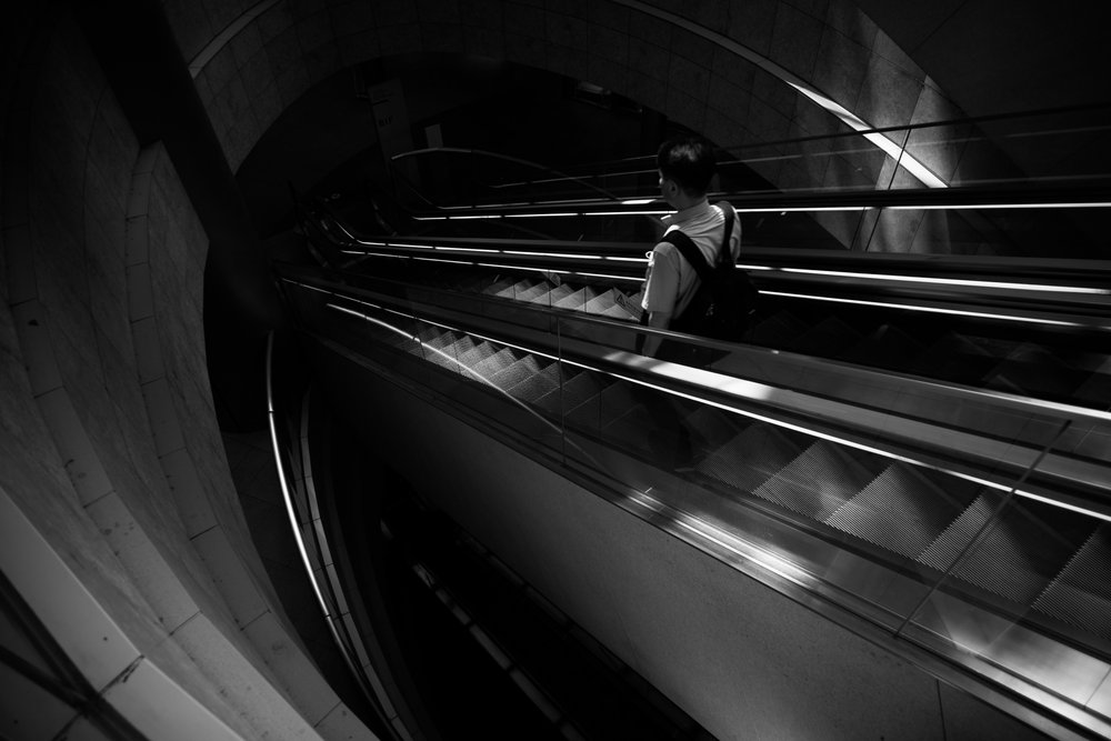 Solitary Escalator Ascent by Satoshi Hata