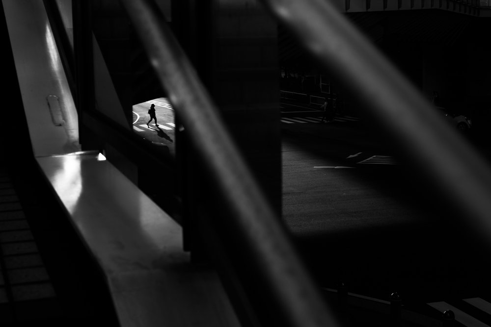 Solitary Figure Walking by Satoshi Hata