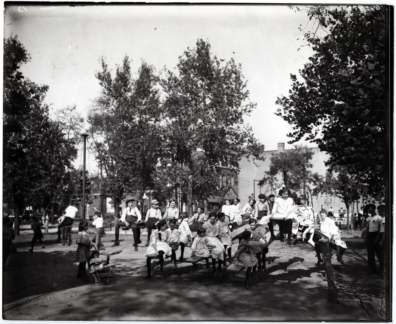 Children Playing on Seesaws in a Park by Unknown