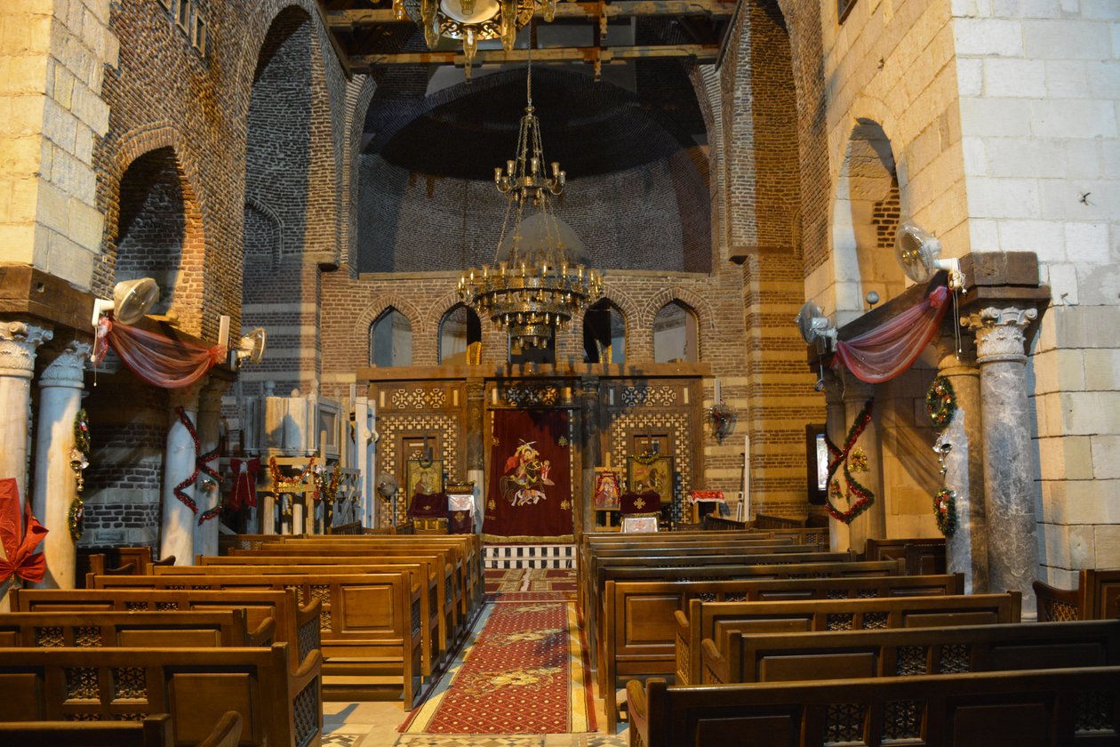 Interior of Saint Mercurius Church Abu Sefein in Old Cairo, historic Coptic Orthodox church with icons and wooden iconostasis by Albert Mansour