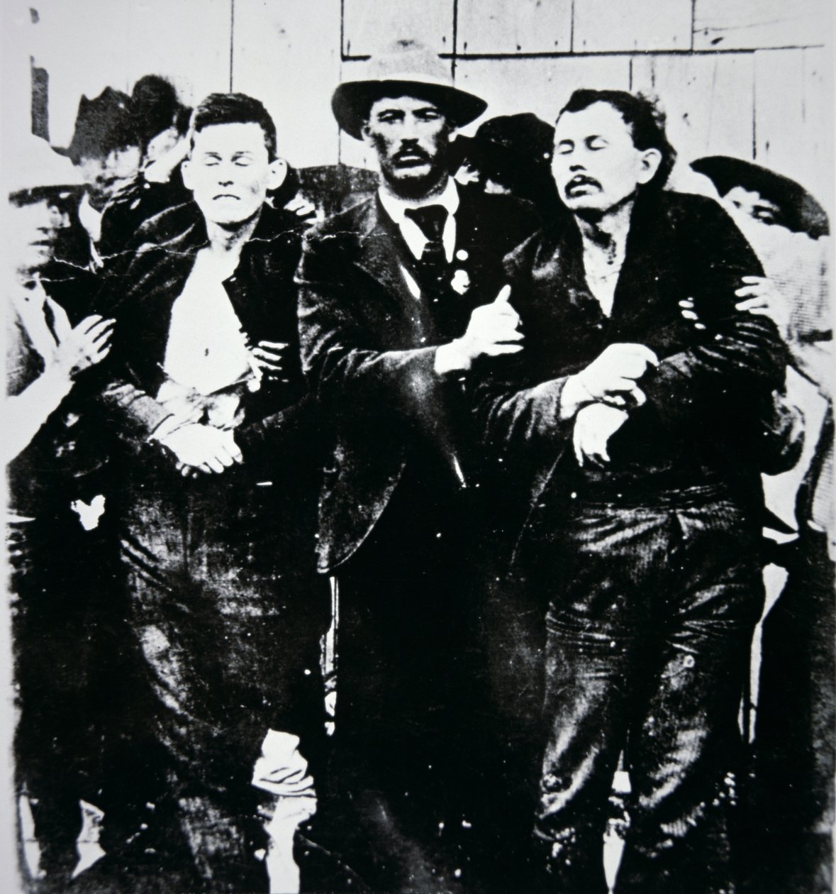 Bob and Grat Dalton with law officers by American Photographer