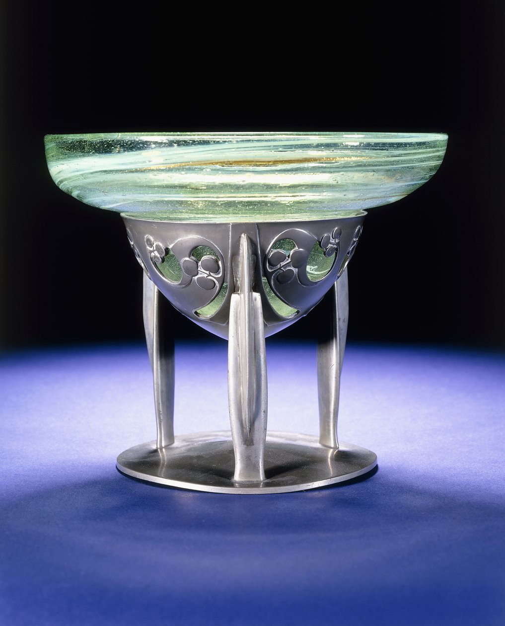 A Liberty Tudric pewter bowl with James Couper & Sons Clutha glass lining, c.1902-05 by Archibald Knox