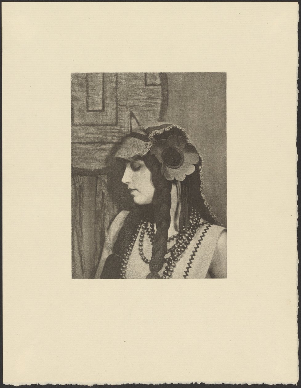 Woman in Bohemian Outfit with Large Flower in Hair by Arthur F. Kales