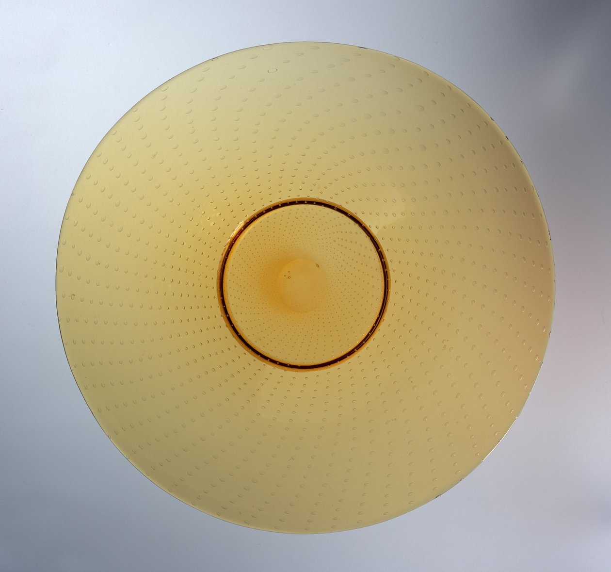 Dish in amber with enclosed bubble pattern, manufactured by James Powell & Sons, c.1938 by Barnaby Powell