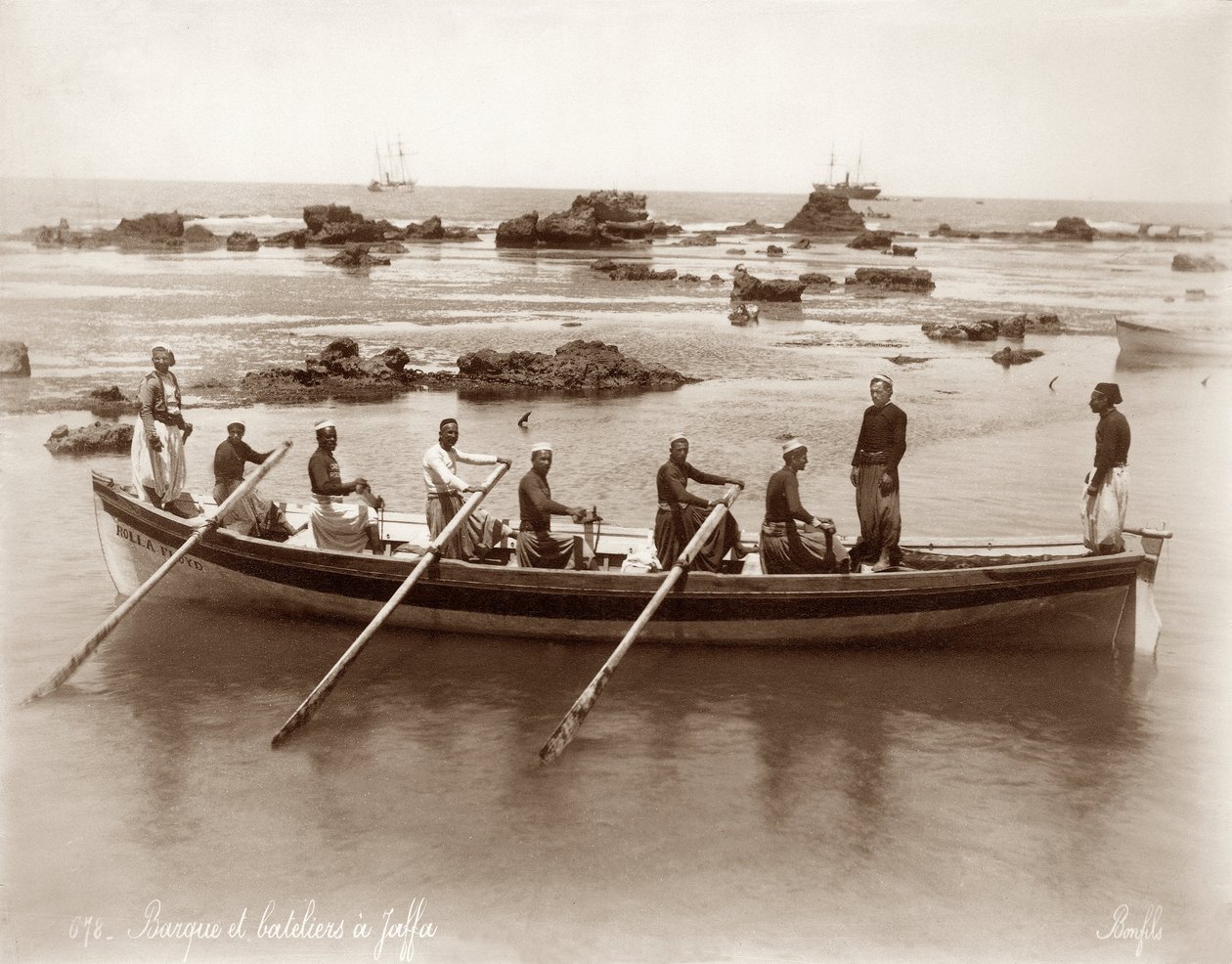 View of a boat and harbour rocks at Jaffa by Bonfils Studio