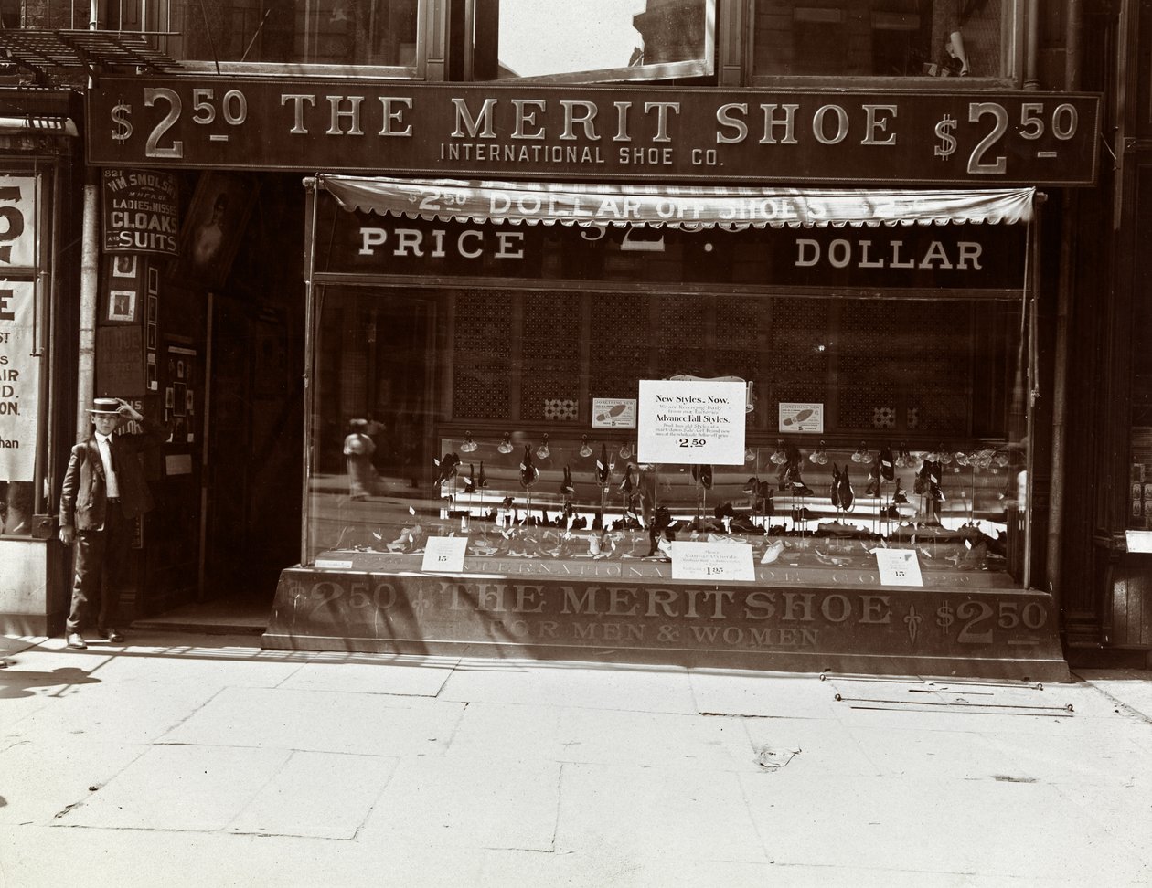 A storefront of the International Shoe Co., New York by Byron Company