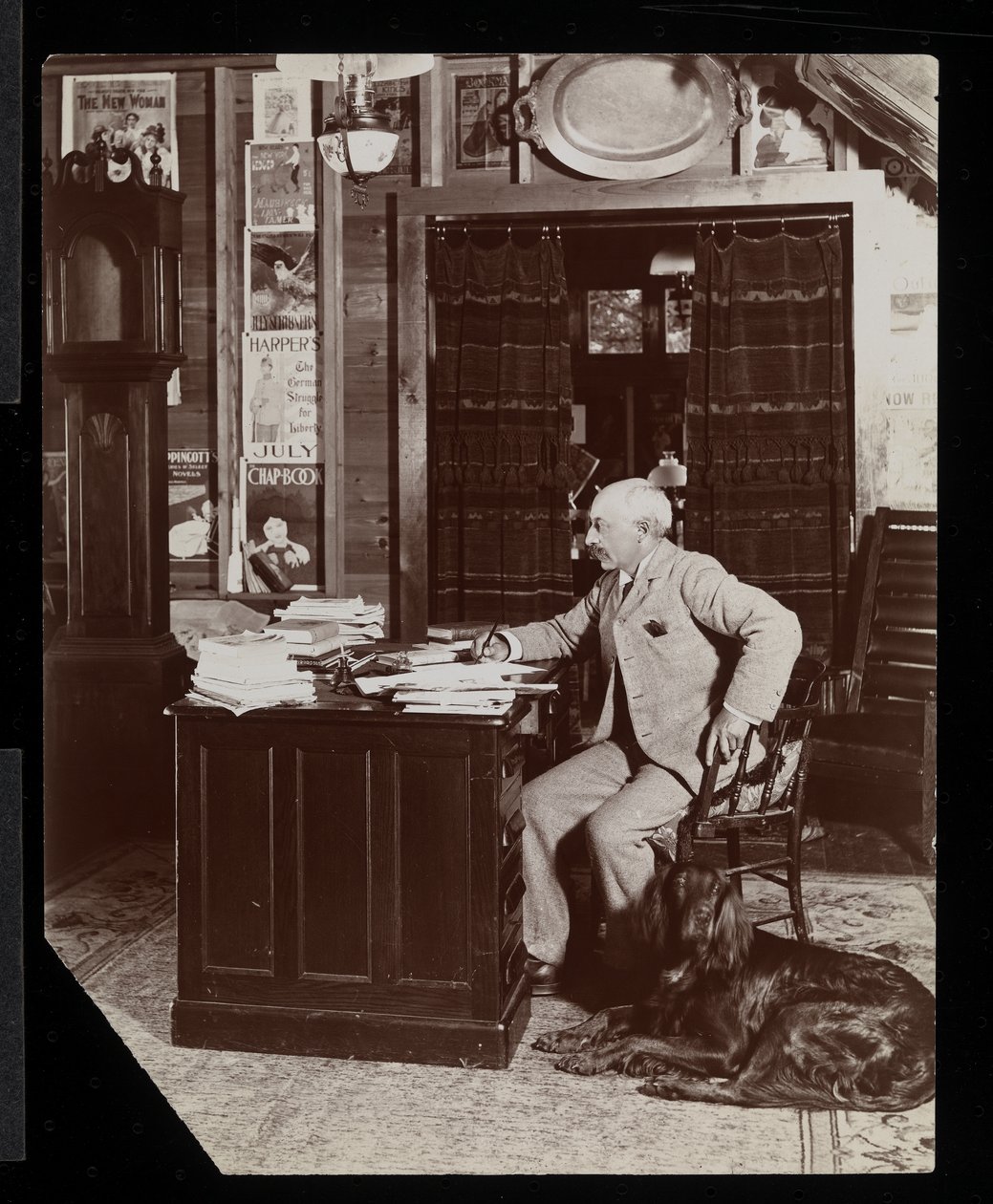 Dr. Worman, proprietor of 'Outing Magazine', in his office at Westport ...