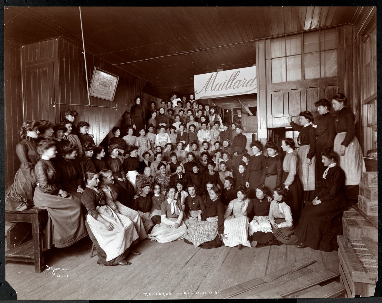 Group portrait of female employees with one man, presumably Mr. Maillard, at Maillard