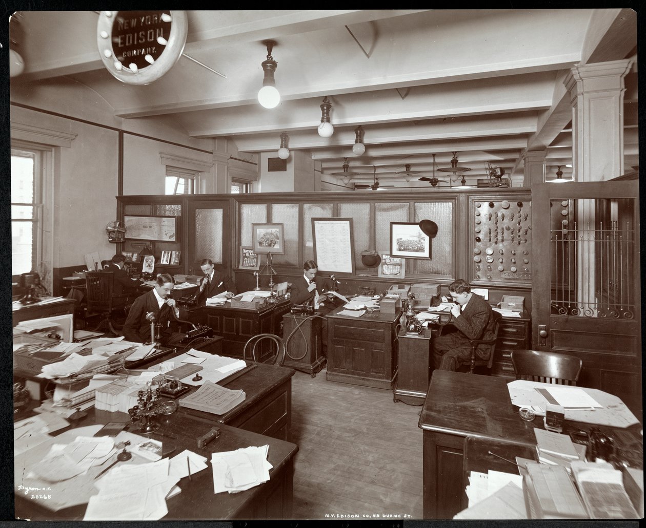 Interior view of men using dictating machines at the New York Edison Co. at 55 Duane Street, New York, 1905 by Byron Company