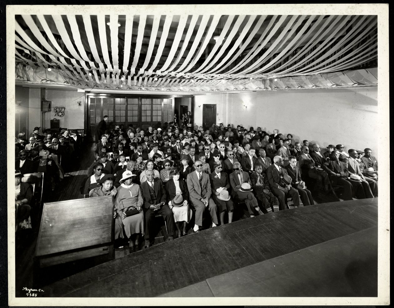 Taken from the Stage of an Audience at a Coloured Party in the Auditorium of the New York Association for the Blind, 111 New York East 59th Street, New York, 1937 by Byron Company