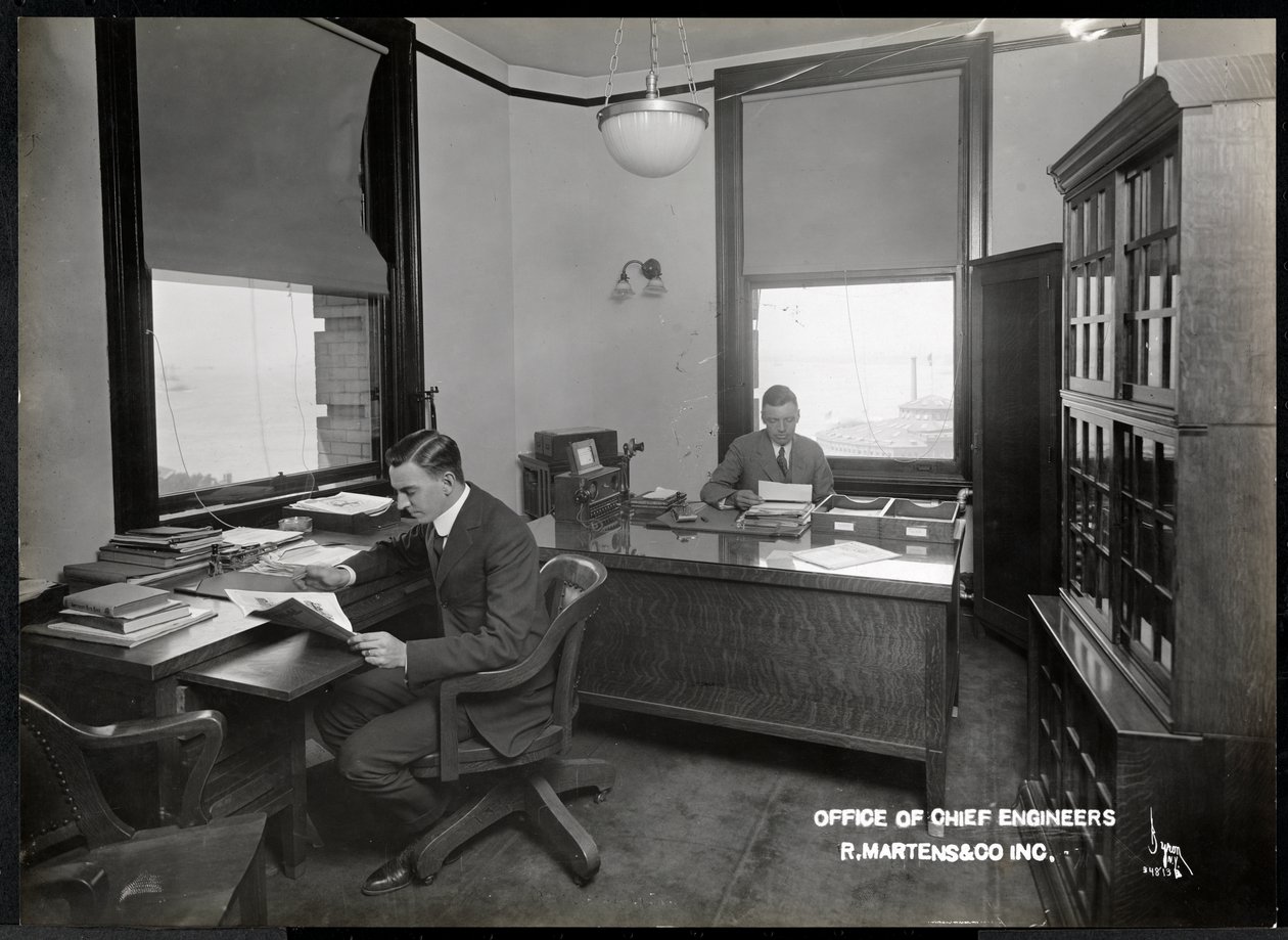 Two Men in the Office of the Chief Engineers of R. Martens und Co. Inc, New York by Byron Company