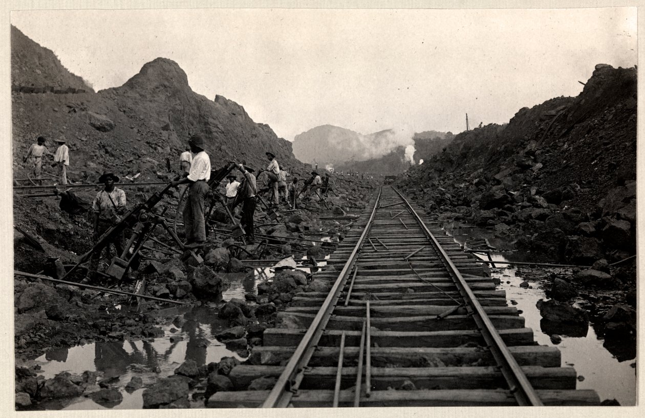 View of Laborers Digging the Panama Canal with Railroad Tracks through the Trench, 1912 or 1913 by Byron Company