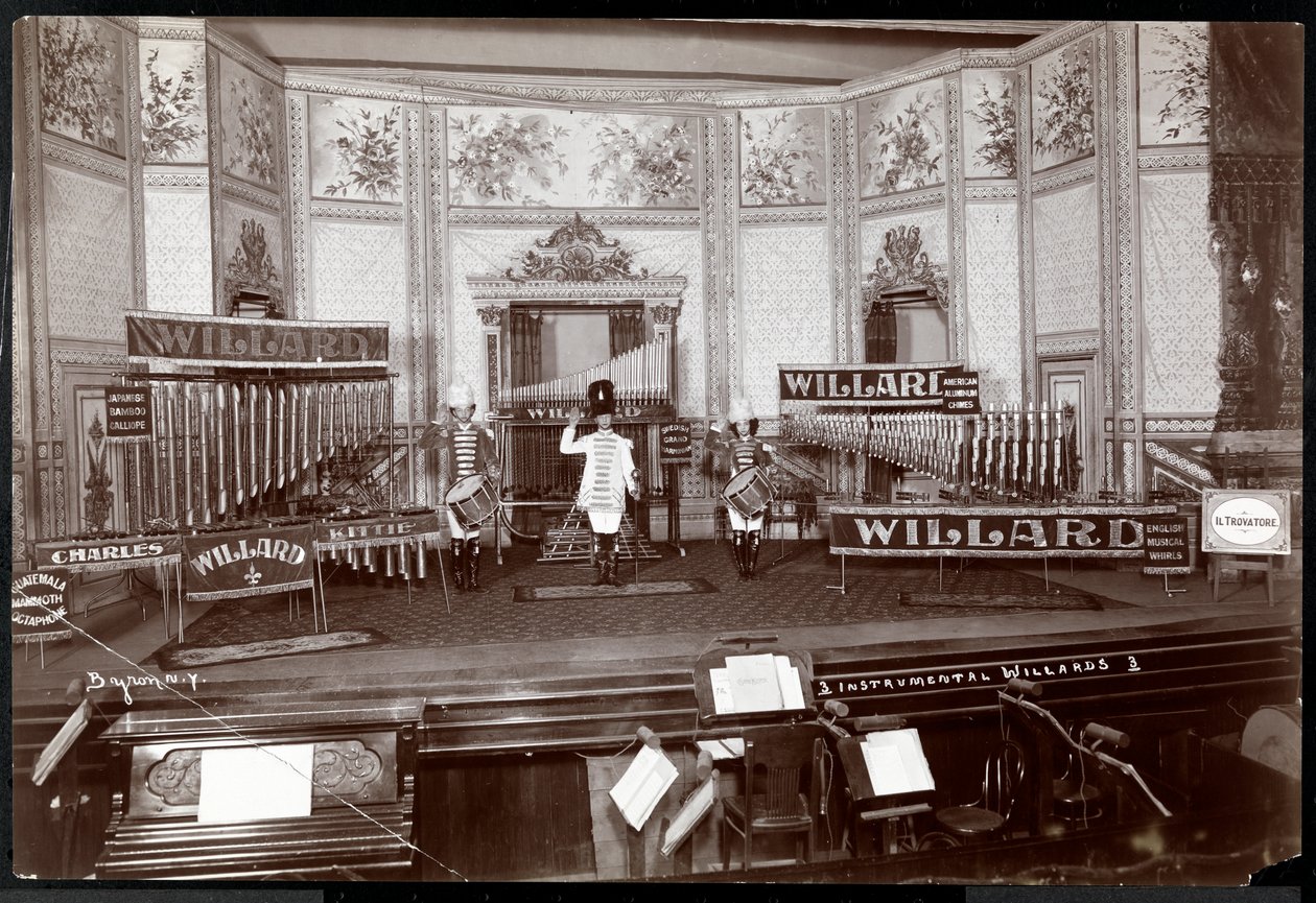View of the Instrumental Willards, in costume on an elaborate stage filled with unique musical instruments, New York, 1907 by Byron Company