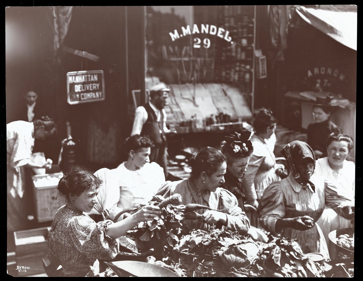 View of women shopping for vegetables from a peddler on Hester Street, New York, 1898 by Byron Company