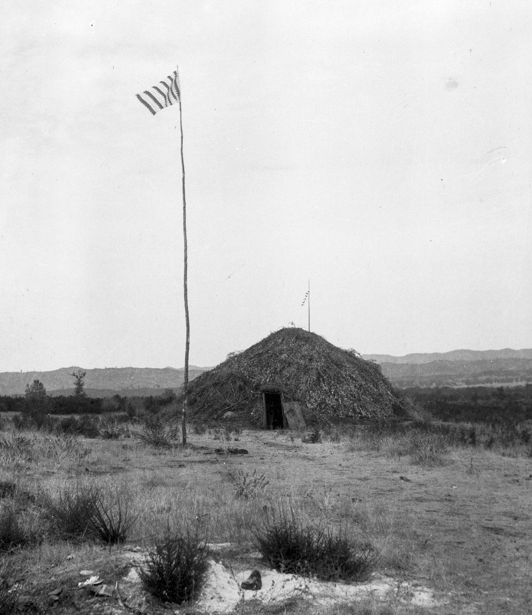 Roundhouse, Am-mah-sha-nah, with flag and an unclear annotation Roundhouse at Stone by C. Hart Merriam