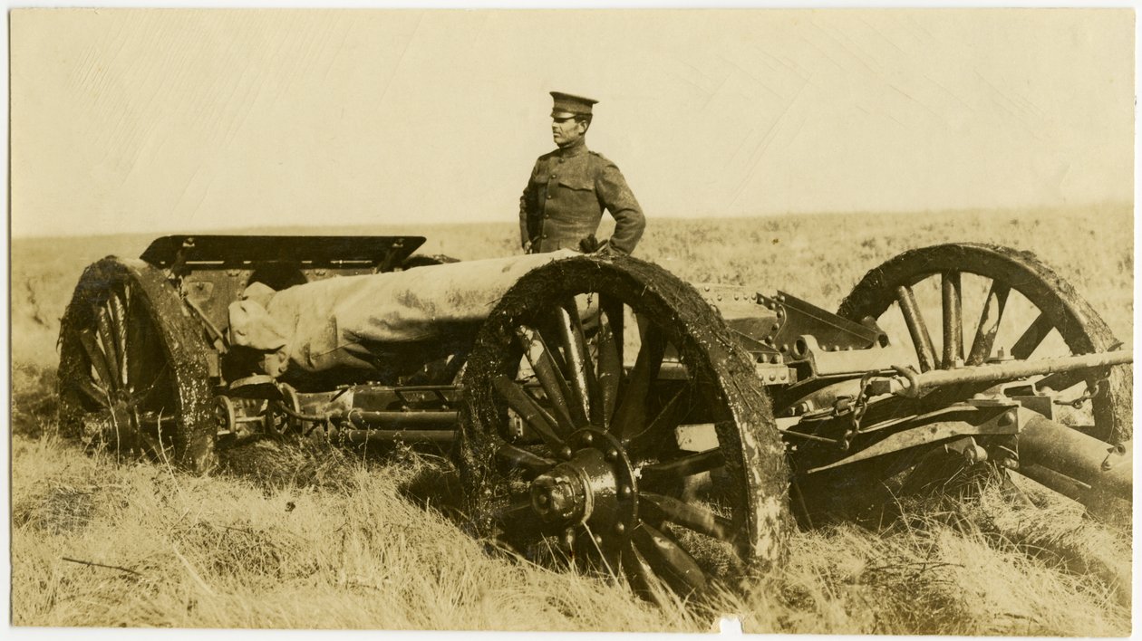 Uniformed Man Standing Next to an Artillery Gun by Carl Michel