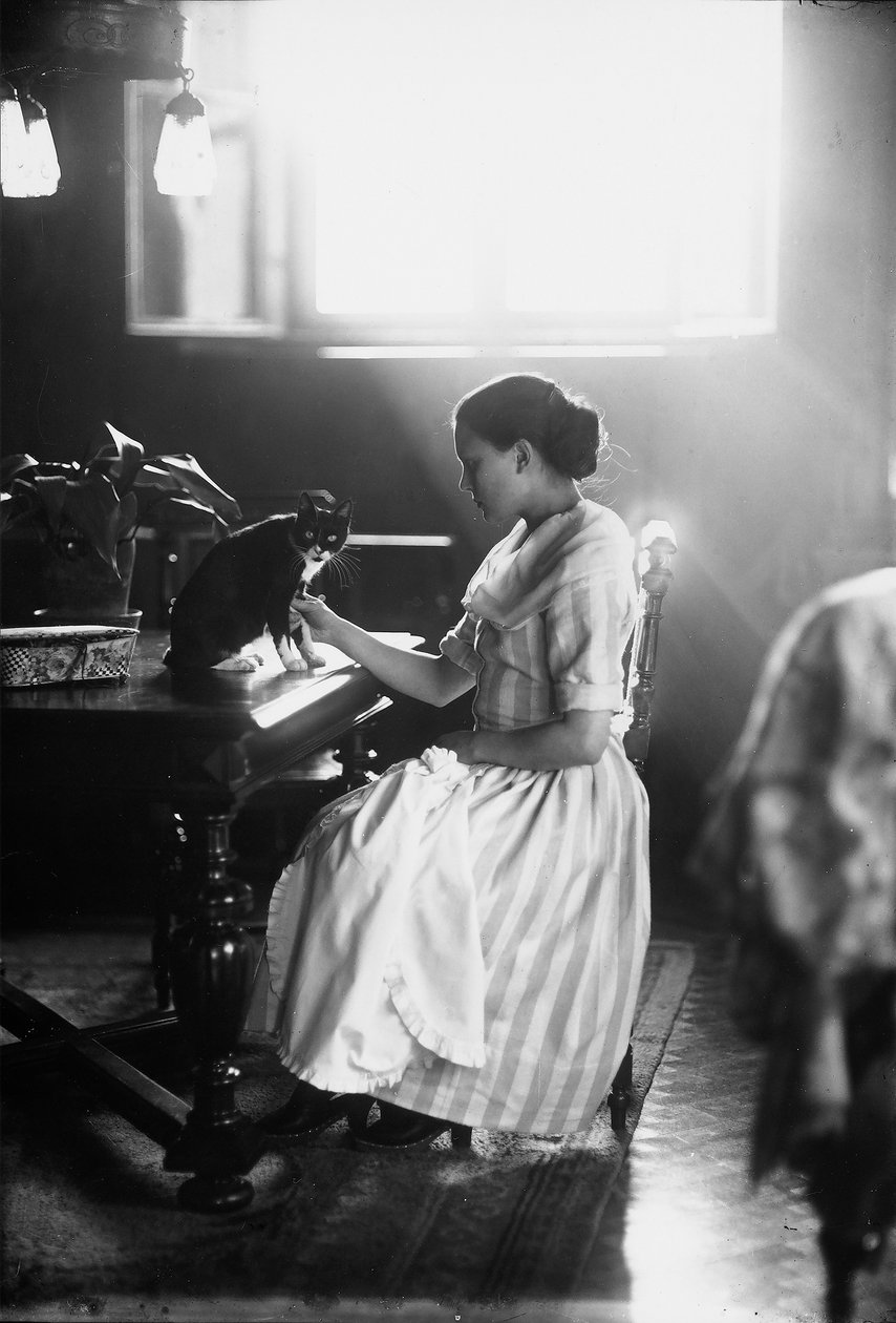 Portrait of Wanda Sitting at a Table with Her Cat, Trieste by Carlo Wulz