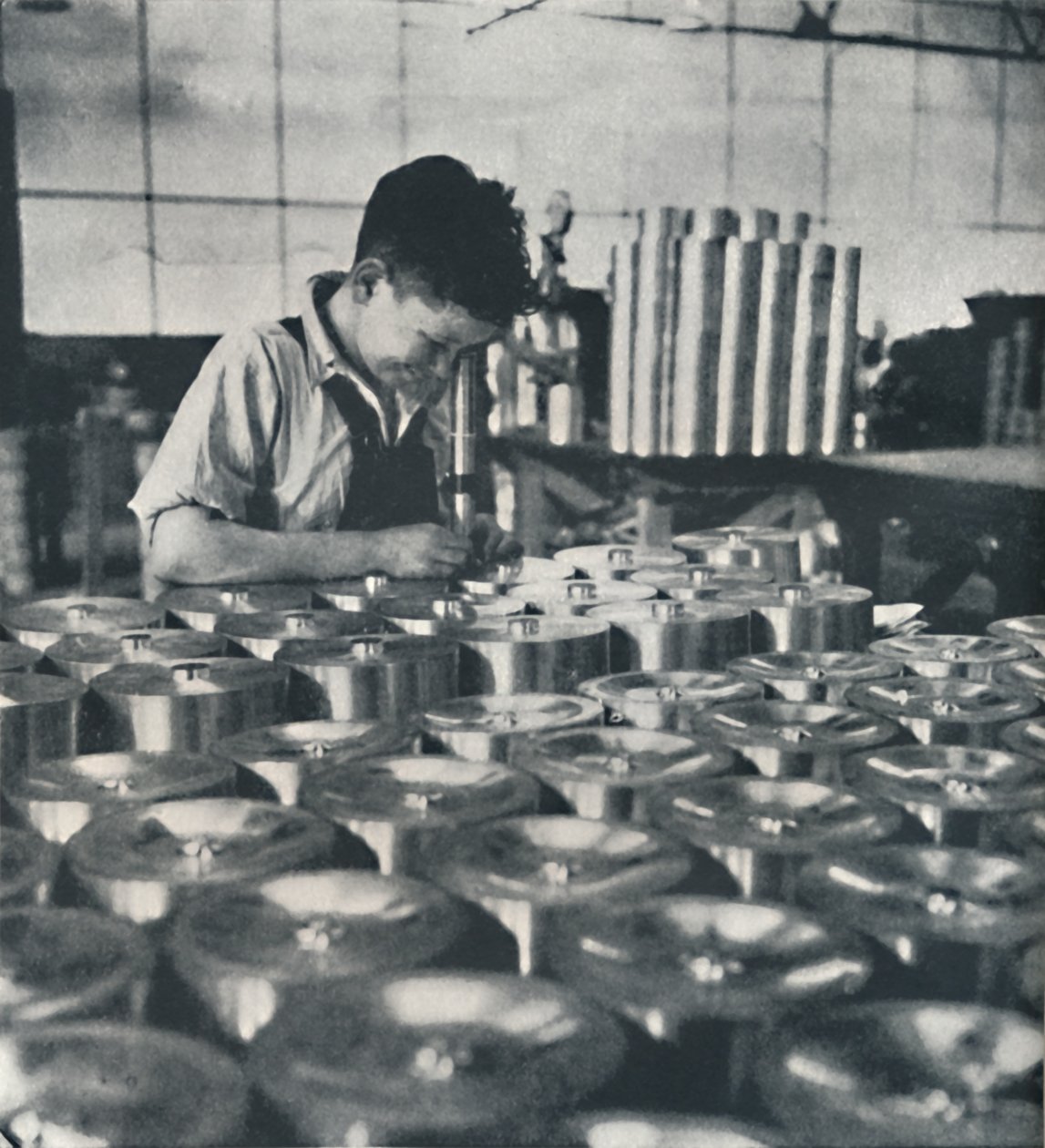 Apprentice with Microscope Testing the Hardness of Pistons, 1941 by Cecil Beaton