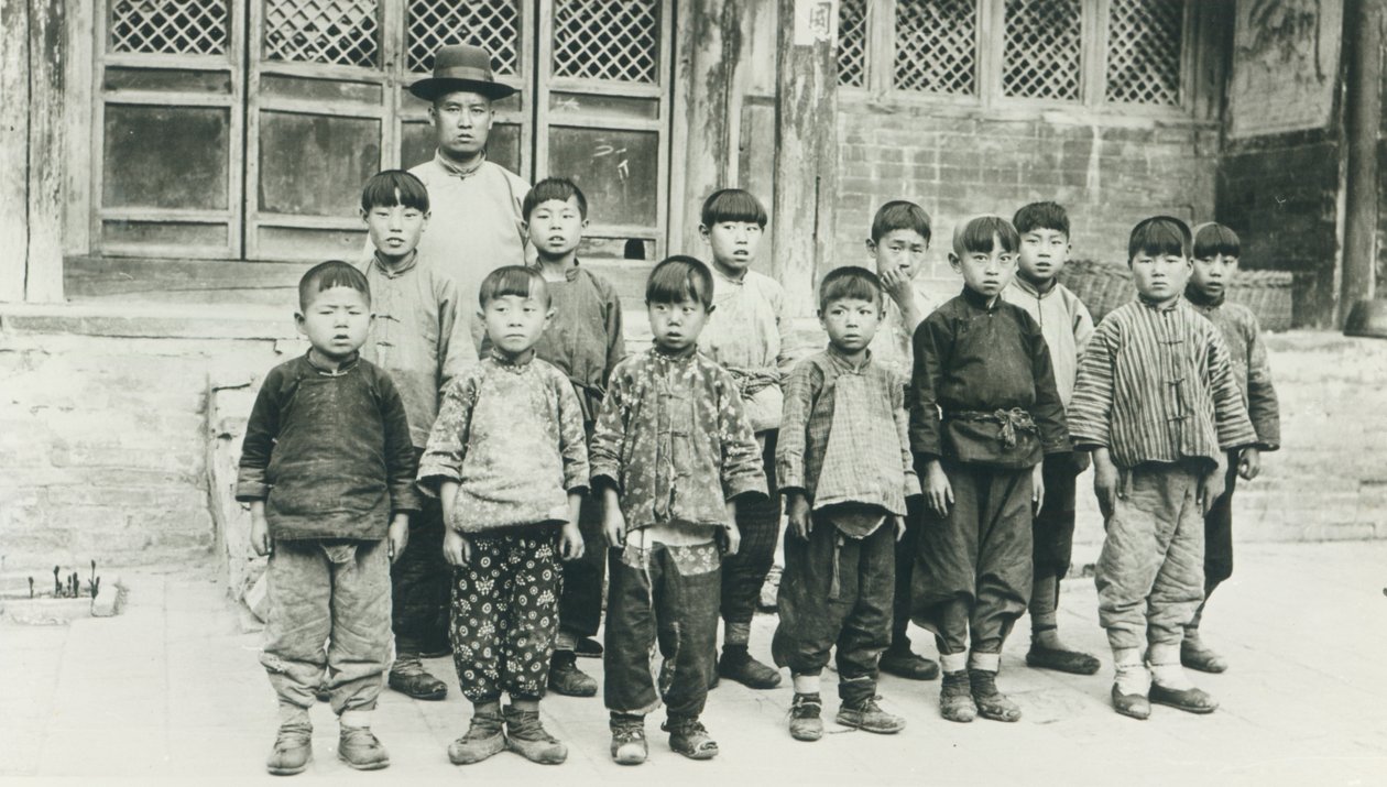 Schoolteacher and pupils by Chinese Photographer