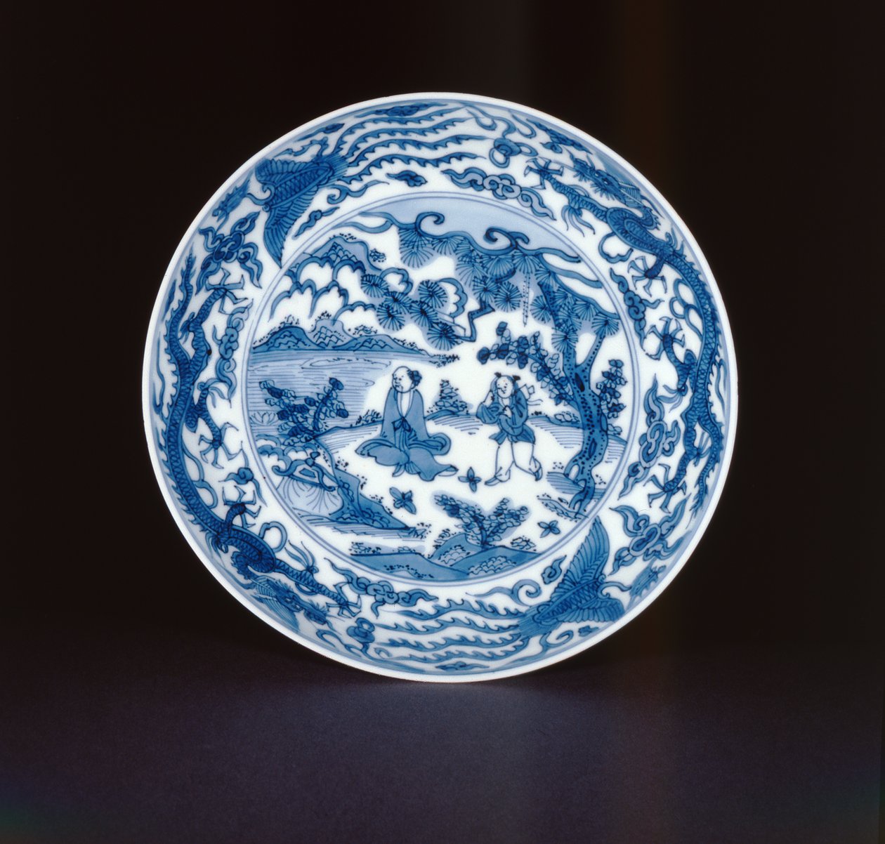 Blue and white dish painted with a sage and attendant, Wanli mark and period, 1573-90 by Chinese School