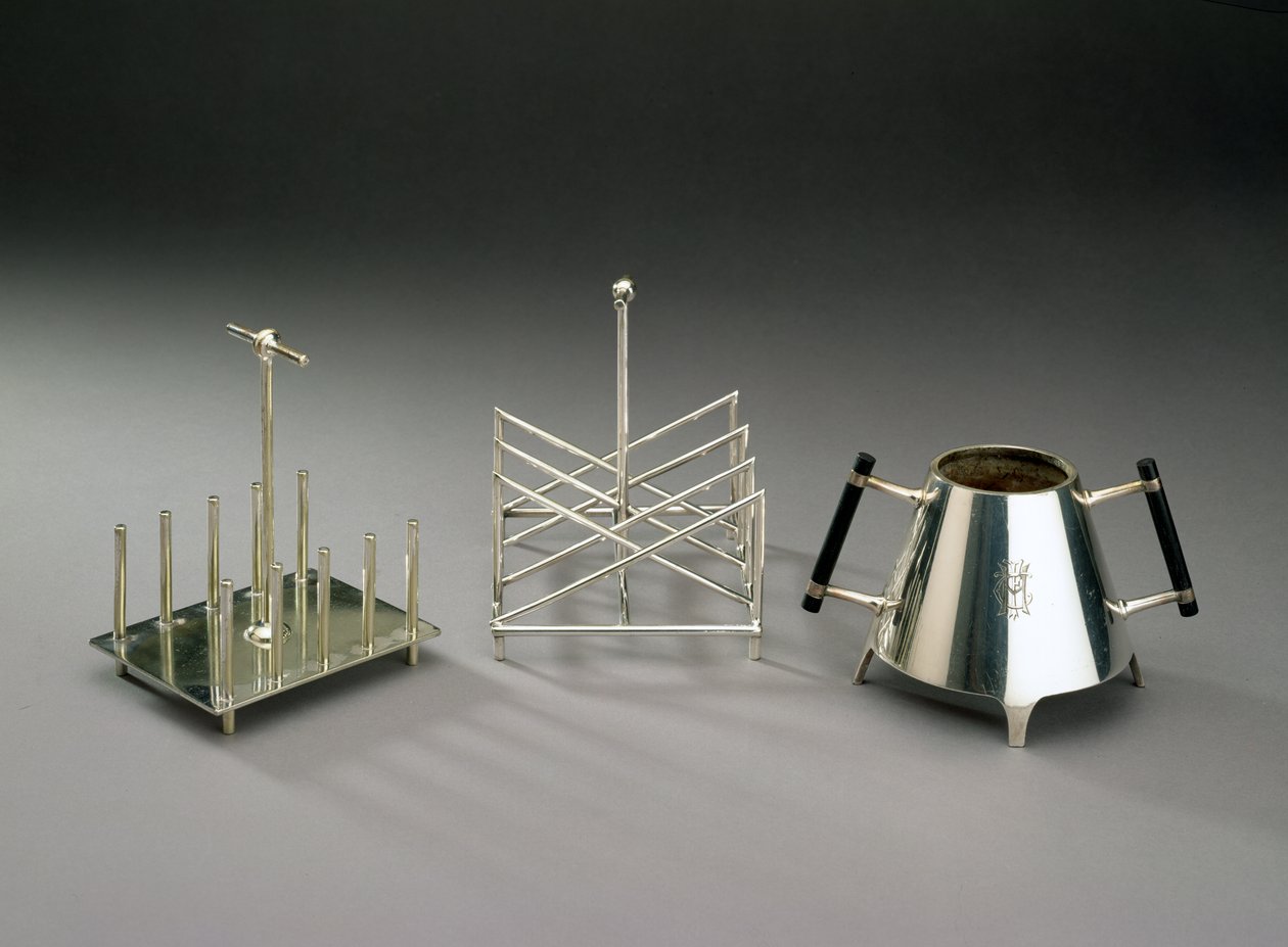 Toast rack with upright supports, manufactured by Hukin & Heath; triangular section toast rack, manufactured by Elkington & Co.; sugar bowl with ebonised wood by Christopher Dresser