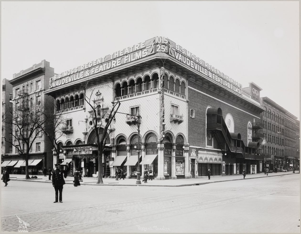 A huge theater with an elaborate facade, complete with Moorish arches and balconies. A large sign on top of the building reads 