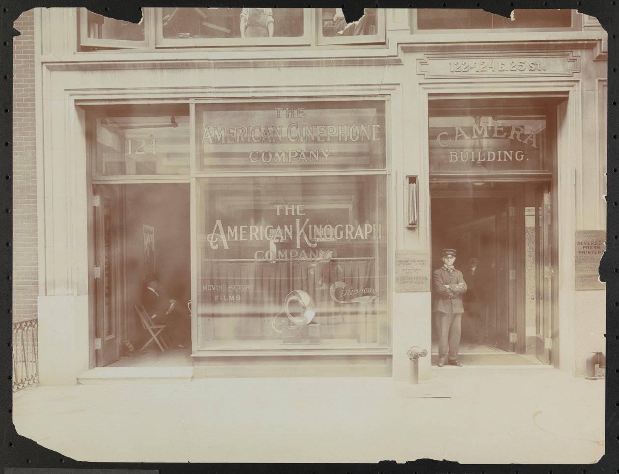 First floor facade of 122-124 E. 25th Street, the Camera Building, American Cinephone Company, American Kinograph Company and doorman, New York by Company Byron