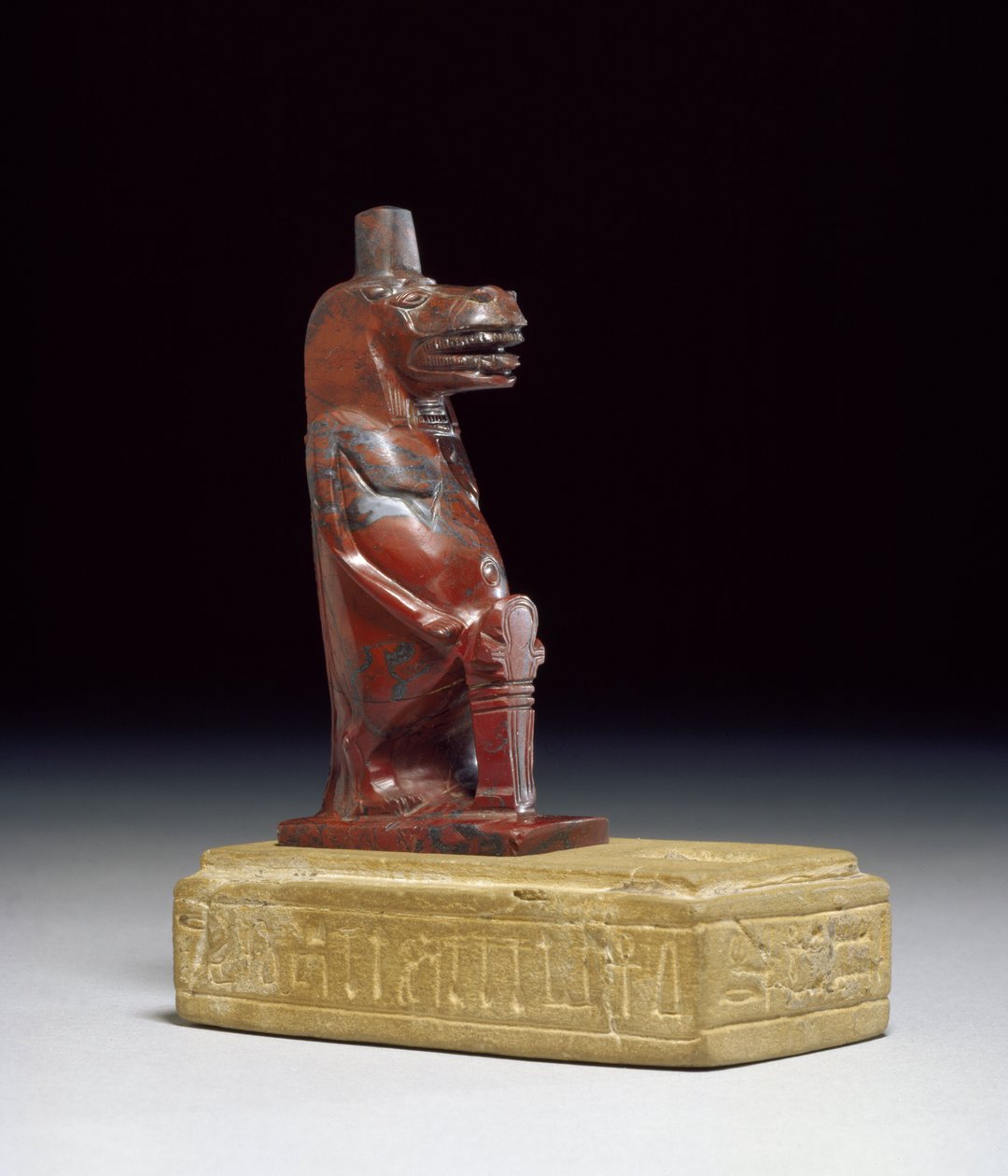 Hippopotamus goddess Taueret, holding a plait of rolled papyrus which forms the protective hieroglyphic sign, 