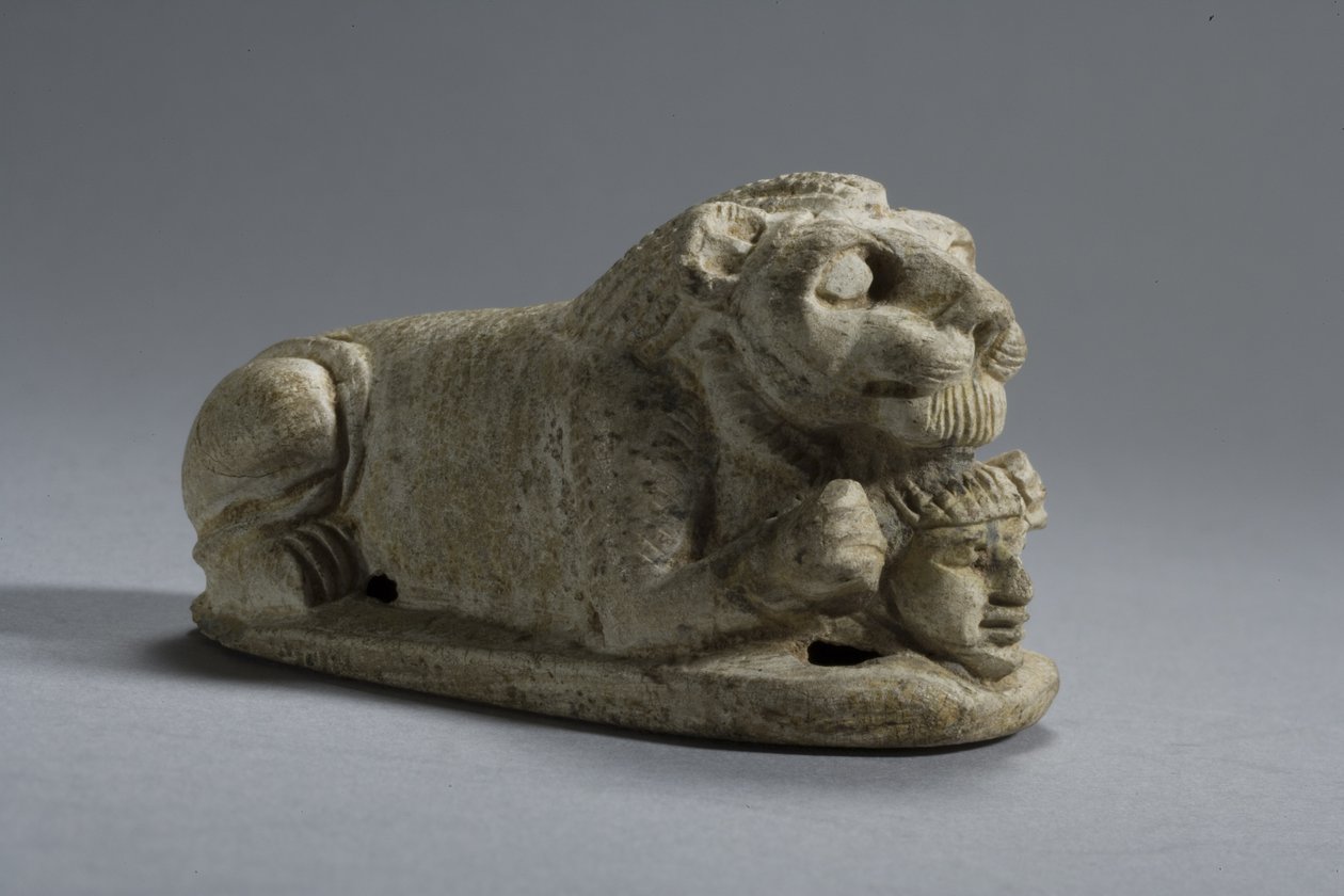 Lid of a recumbent Lion clutching a Head, Napata-Meroe, Upper Nubia by Egyptian