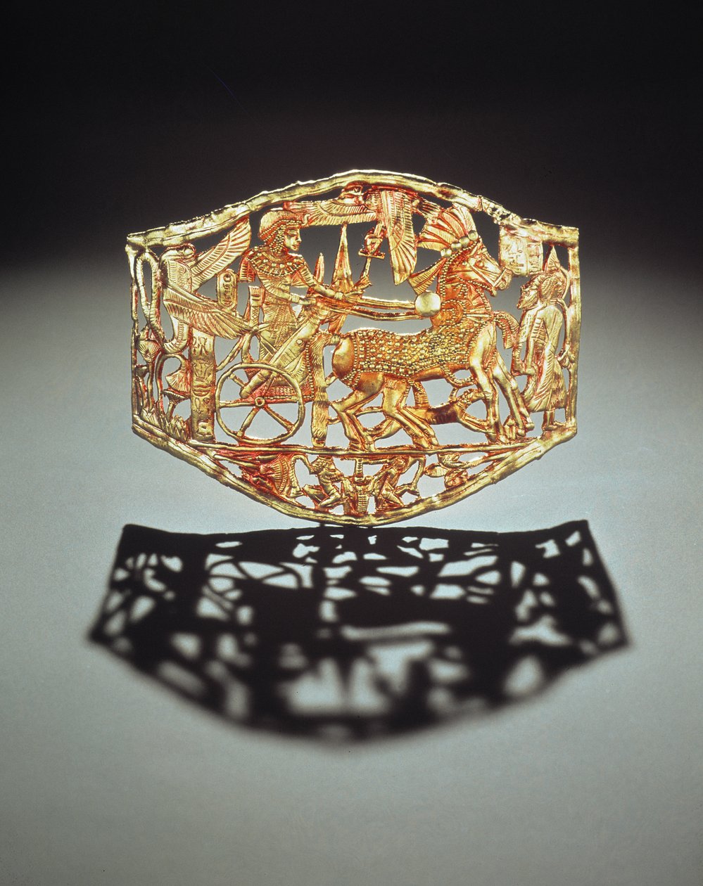 Openwork plaque or buckle showing the kings triumphal return with prisoners, from the Tomb of Tutankhamun, New Kingdom by Egyptian 18th Dynasty