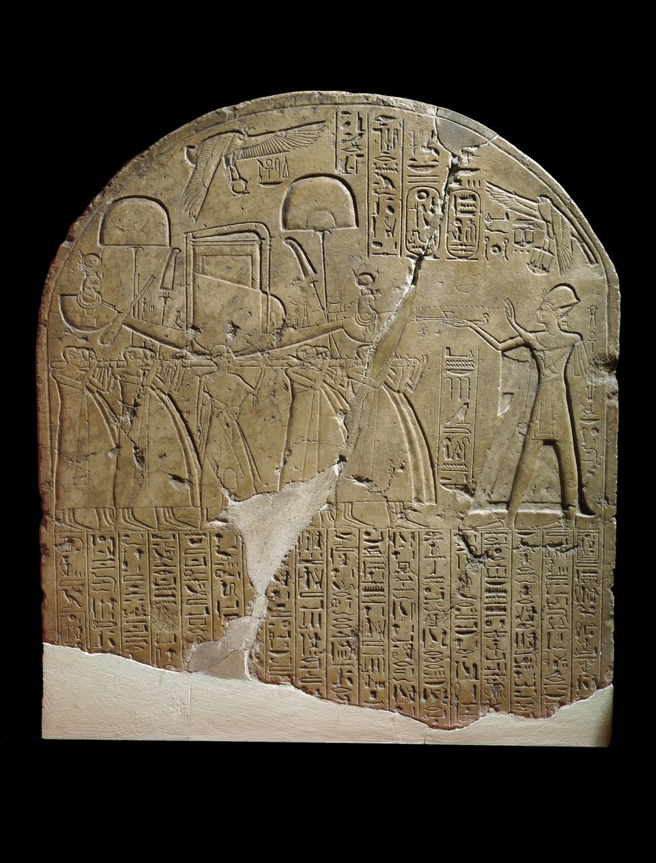 Stela Dedicated to Isis by the Overseer of Works in the Temples of Ramesses II at Koptos, Depicting the King Offering Incense to the Sacred Boat of Isis, Carried by Priests by Egyptian 19th Dynasty